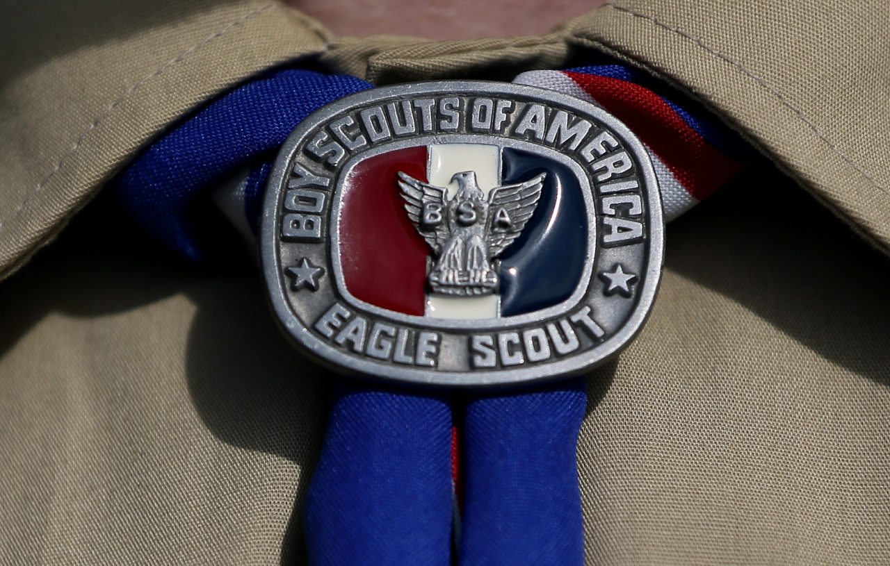 IRVING, TX - FEBRUARY 04: A detial view of a Boy Scout uniform on February 4, 2013 in Irving, Texas. The BSA national council announced they were considering to leave the decision of inclusion of gays to the local unit level. U.S. President Barack Obama urged the organization to end a ban on gays.