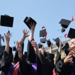BONN, GERMANY - JULY 04: Students throw up their graduate caps during the 11th celebrations of the Rheinische Friedrich-Wilhelms-Universitaet on July 4, 2015 in Bonn, Germany. This year, 780 women and 293 men finished their studies successfully.