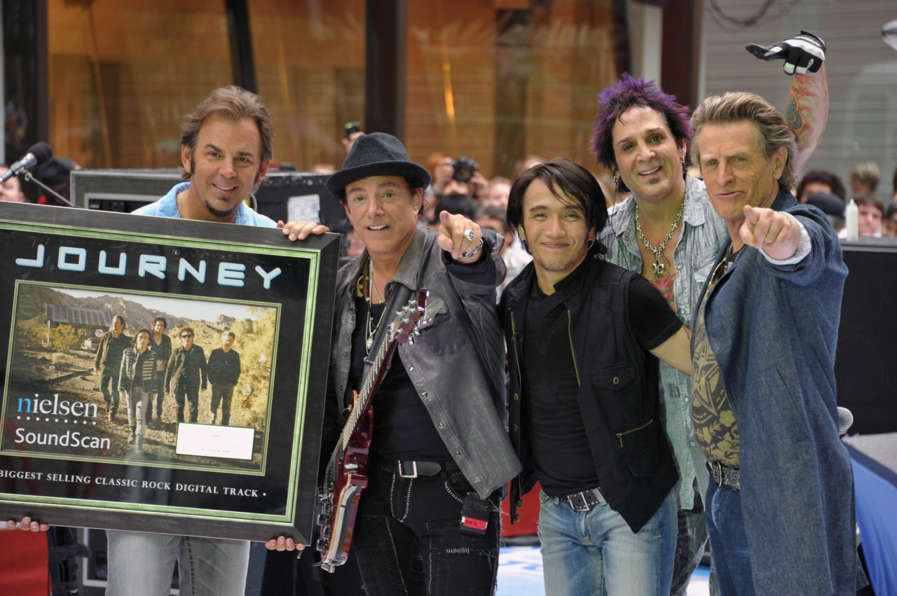 NEW YORK, NY - JULY 29: (L-R) keyboard player Jonathan Cain, guitar player Neal Schon, singer Arnel Pineda, drummer Deen Castronovo, and bass player Ross Valory of the band Journey performs at the 2011 Today Summer Concert series at Rockefeller Plaza on July 29, 2011 in New York City.