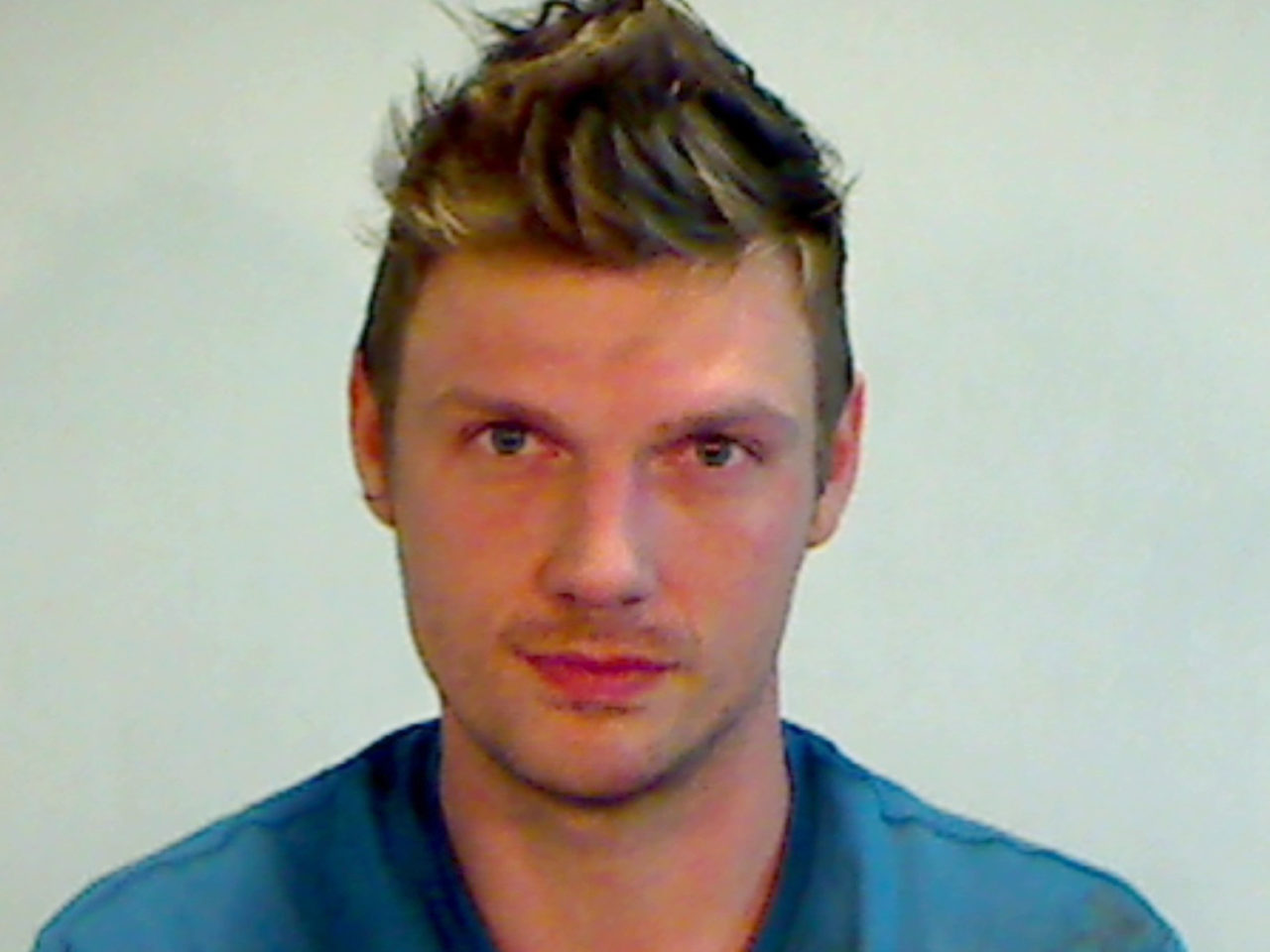 KEY WEST, FL - JANUARY 13: (EDITORS NOTE: Best quality available) In this handout photo provided by the Key West Police Department, singer Nick Carter of the Backstreet Boys is seen in a police booking photo after his arrest for misdemeanor battery January 13, 2015 in Key West, Florida. The arrest followed and incident at Hogs Breath Saloon in Key West after Carter and another man he was with were allegedly in an altercation with employees of the bar.