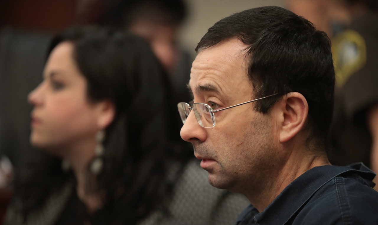 LANSING, MI - JANUARY 16: Larry Nassar sits with his attorney Shannon Smith as he appears in court to listen to victim impact statements prior to being sentenced after being accused of molesting about 100 girls while he was a physician for USA Gymnastics and Michigan State University, where he had his sports-medicine practice on January 16, 2018 in Lansing, Michigan. Nassar has pleaded guilty in Ingham County, Michigan, to sexually assaulting seven girls, but the judge is allowing all his accusers to speak. Nassar is currently serving a 60-year sentence in federal prison for possession of child pornography.
